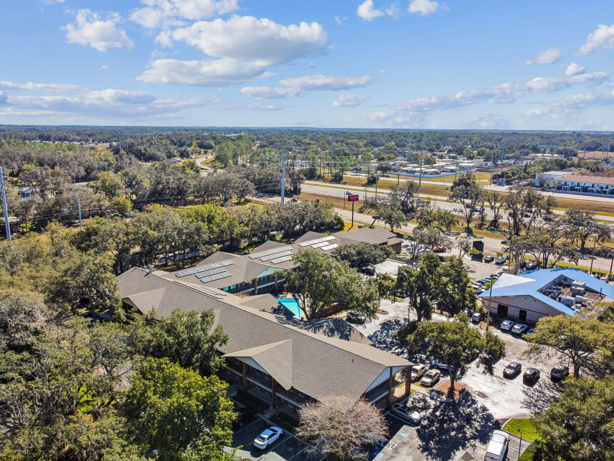 Aerial view showing solar panel array on hotel roof